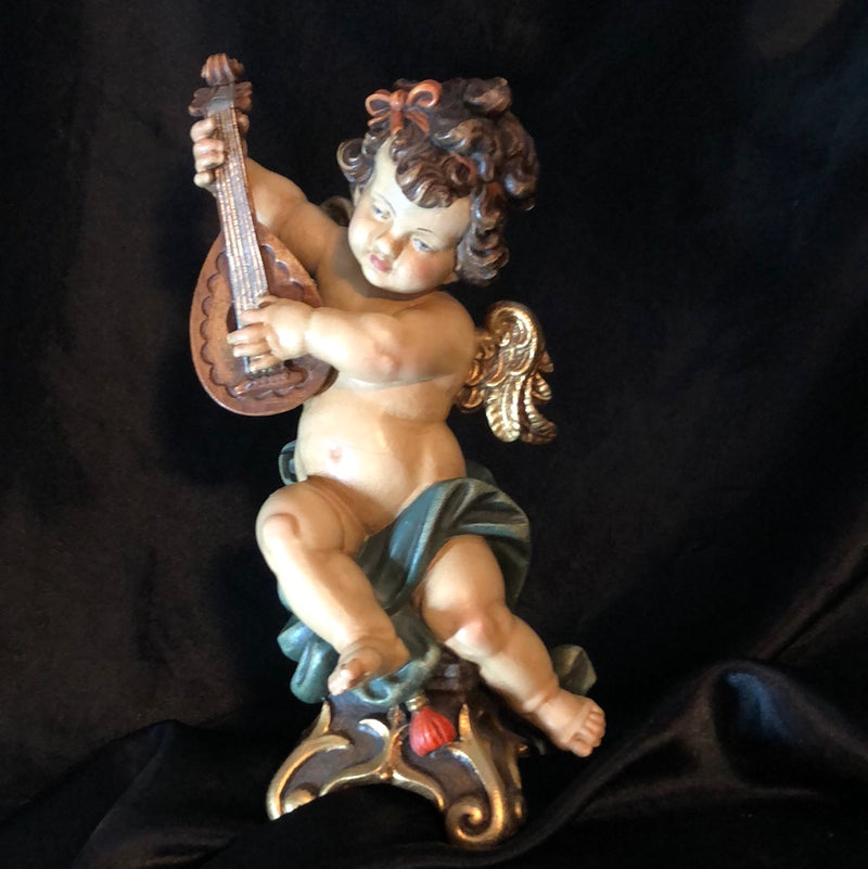 Reichberger Angel on console playing Mandolin Sculpture